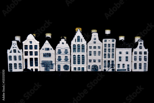 Den Helder, Netherlands. December 2022. Ceramic houses with Dutch gables on a black background.