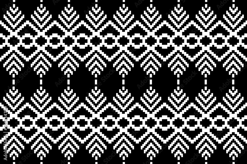 Beautiful black and whiteThai knitted embroidery . geometric ethnic oriental pattern traditional on black background, Thai pattern culture isolated with clipping path Beautiful black and whiteThai knitted embroidery . geometric ethnic oriental pattern traditional on black background, Thai pattern culture isolated with clipping path