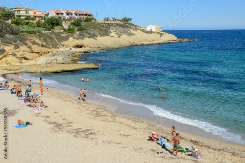 People sunbathing on the Beach of Balai at Porto Torres on Sardinia in Italy