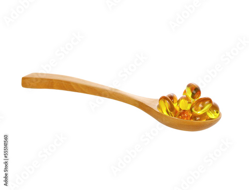 Fish oil pill in wooden spoon on transparent , png.