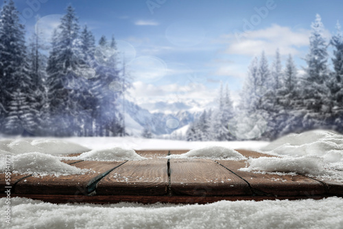 Winter wooden table on a frosty day with snow and free space © magdal3na
