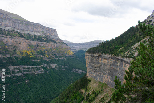 View of large mountains separated by cliffs and some with curious vertical rock walls and no vegetation