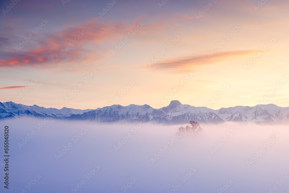 misty sunset with Stockhorn ridge in the distance
