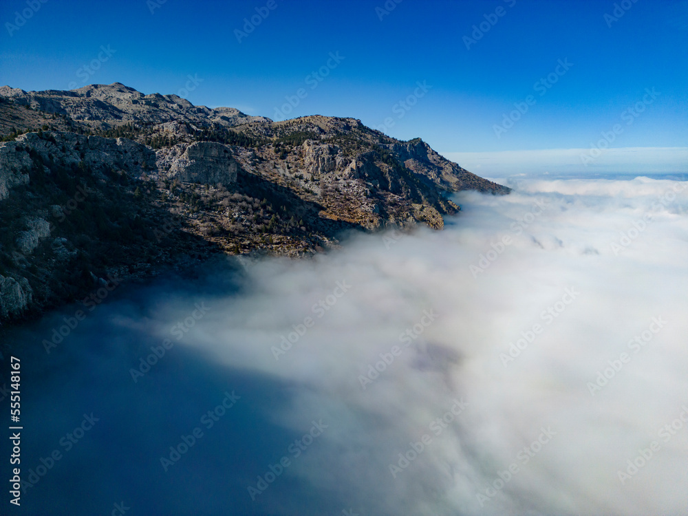 foggy aerial views at the top of enormous mountains