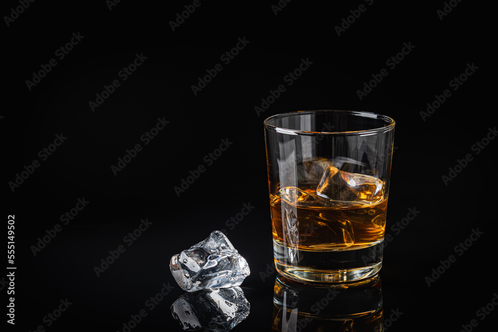 Whiskey with ice in glasses Whiskey with ice in glasses