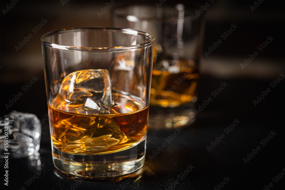 Whiskey with ice in glasses Whiskey with ice in glasses