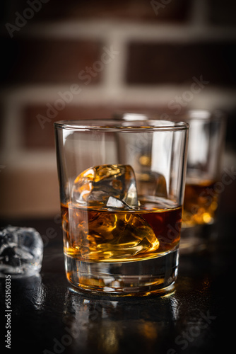 Whiskey with ice in glasses