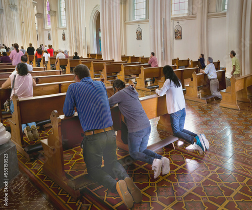 People praying in Catholic  Church in Costa Rica.  © Loren Biser