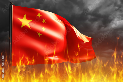 China flag on fire. Waving flag of China in night sky. Tongues of fire under flagpole with PRC symbol. Political problems in Peoples Republic of China concept. Destabilization Chinese state. 3d image photo