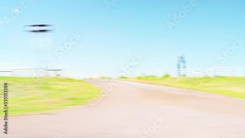 Interstate highway 82, Electra Texas with agricultural farm field on rural countryside road pov point of view vehicle shot photo