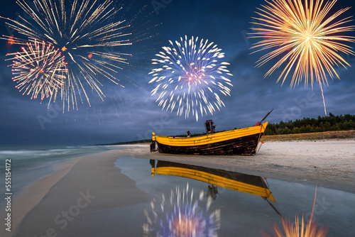 Fototapeta Naklejka Na Ścianę i Meble -  Happy New Year fireworks over Baltic Sea on the beach on Poland, Europe