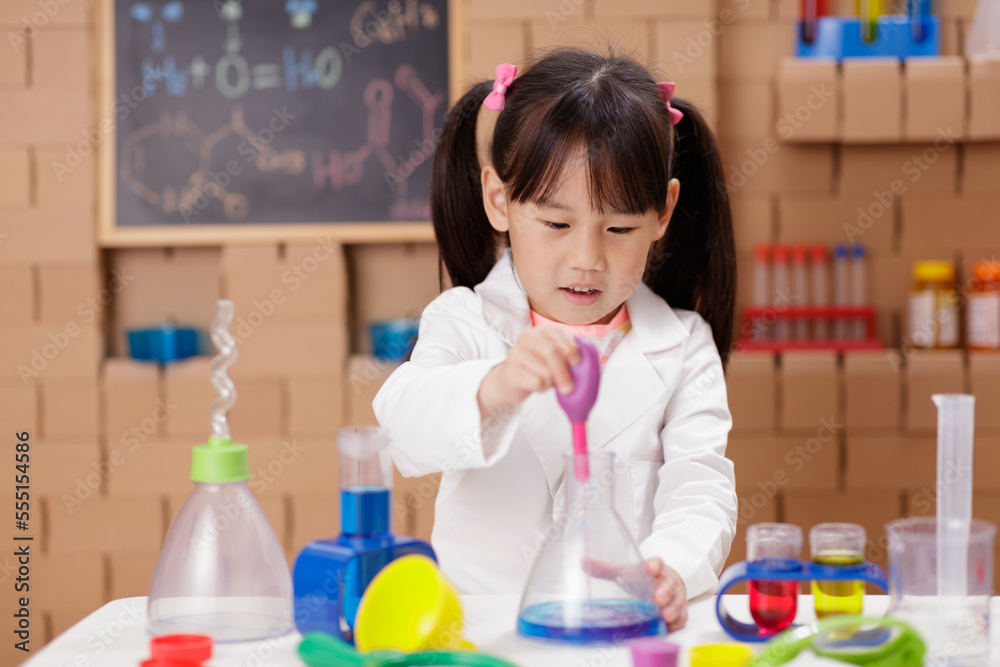 young girl plays science experiment for home schooling young girl plays science experiment for home schooling