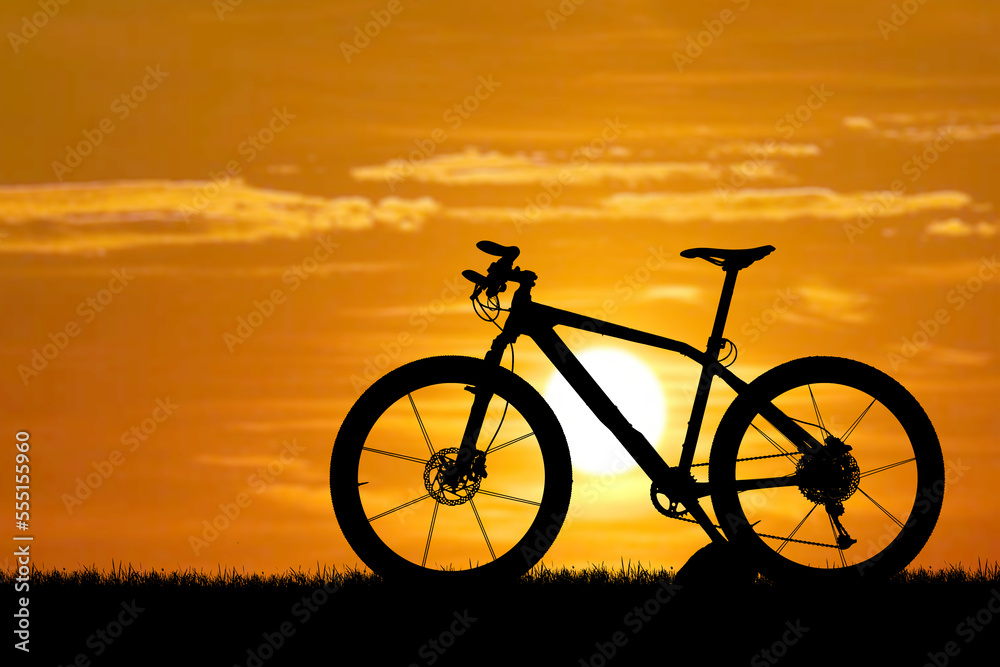 silhouette of a bicycle on a sunset