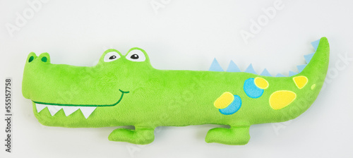 Plush green crocodile.Children s soft toy for children on a white background.