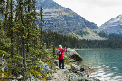 Female hiker at Lake Oesa, Yoho National Park; British Columbia, Canada photo