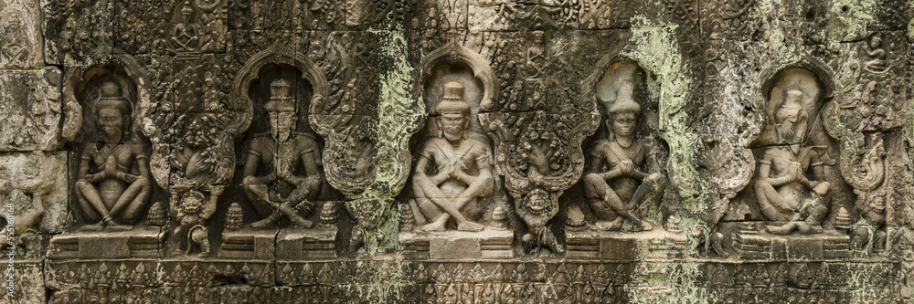 Panorama of five seated figures in bas-relief, Preah Khan, Angkor Wat; Siem Reap, Siem Reap Province, Cambodia Panorama of five seated figures in bas-relief, Preah Khan, Angkor Wat; Siem Reap, Siem Reap Province, Cambodia