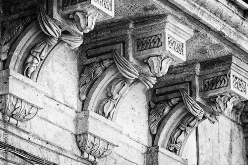 Decorative building facade with corbels; Sicily, Italy photo