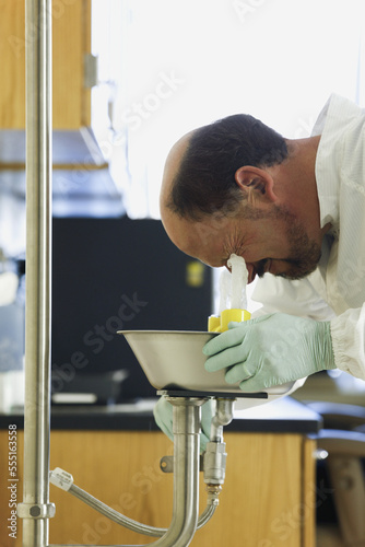 Scientist using eyewash