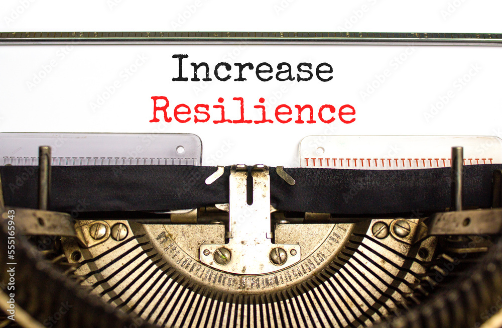 Increase resilience symbol. Concept word Increase resilience typed on retro old typewriter. Beautiful white background. Business and increase resilience concept. Copy space.