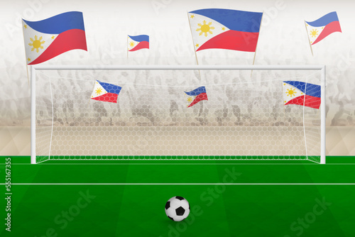 Philippines football team fans with flags of Philippines cheering on stadium, penalty kick concept in a soccer match.