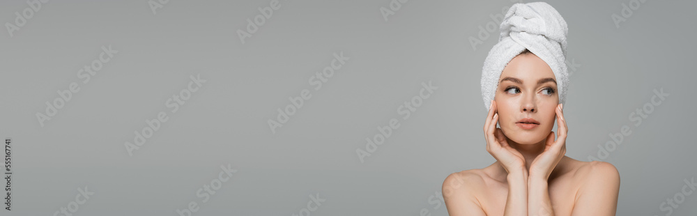 young woman with bare shoulders and towel on head looking away isolated on grey, banner young woman with bare shoulders and towel on head looking away isolated on grey, banner