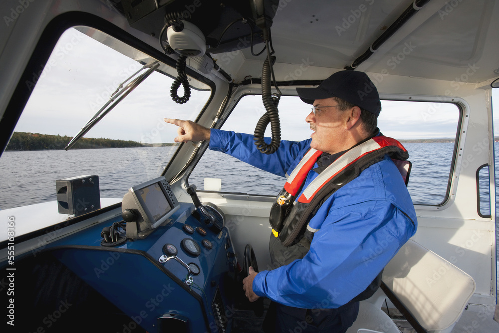 Security guard controlling a boat Security guard controlling a boat