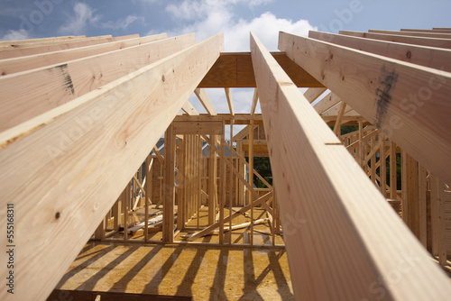 Low angle view of roof rafters of a house