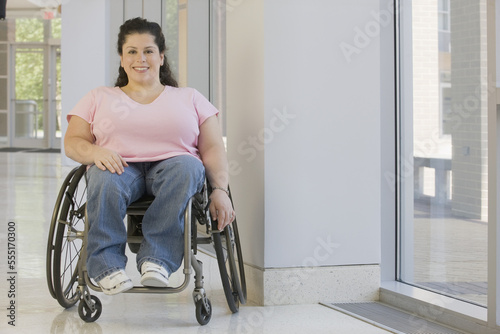 Woman with Spina Bifida sitting in a wheelchair and smiling photo