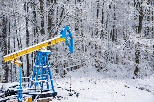 Yellow-blue oil well in the Ukrainian Carpathians.