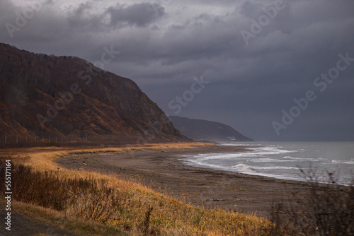 landscape of mountains among the sea and surf waves