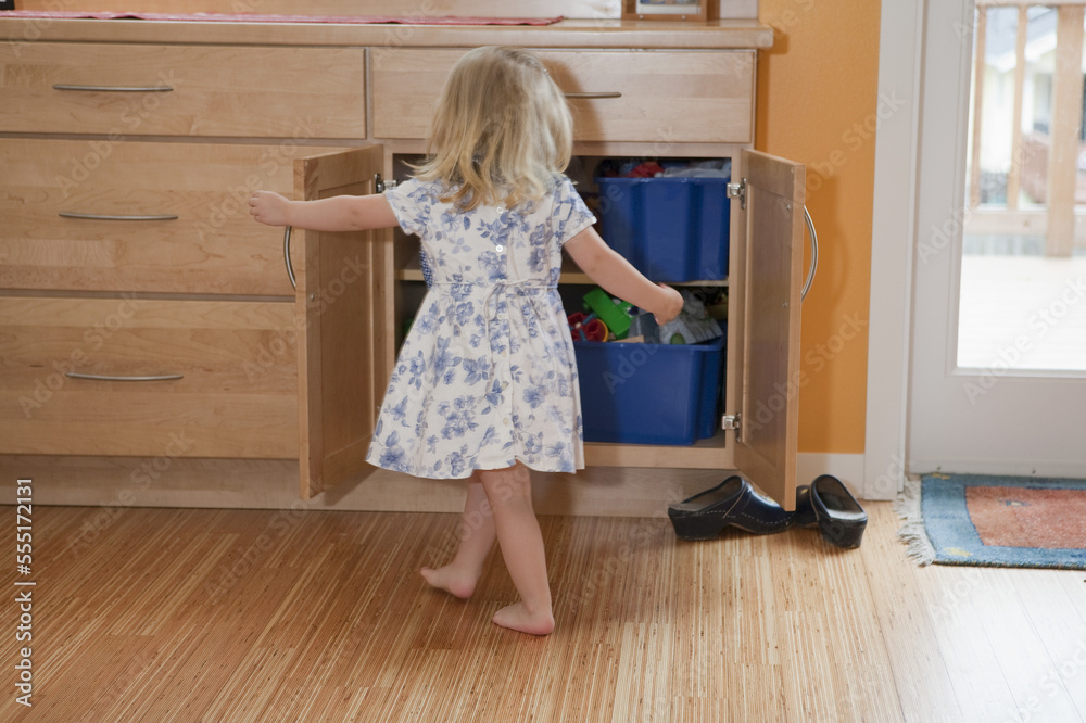 Girl searching in a closet of a disability accessible home Girl searching in a closet of a disability accessible home