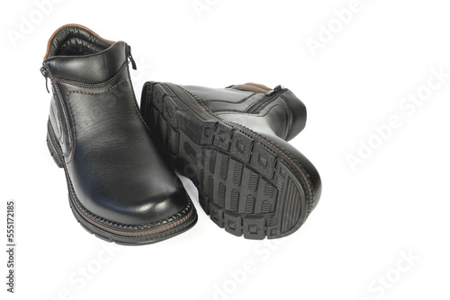 Men's black winter boots on a white background, one on the side
