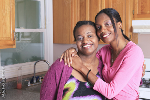 Portrait of two sisters smiling, one with learning disability photo