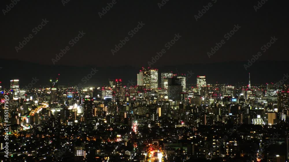 NAGOYA, JAPAN - OCTOBER 2022 : Aerial high angle view of NAGOYA CITY at night. View of buildings and street traffic around Nagoya station and Sakae area (central downtown). NAGOYA, JAPAN - OCTOBER 2022 : Aerial high angle view of NAGOYA CITY at night. View of buildings and street traffic around Nagoya station and Sakae area (central downtown).