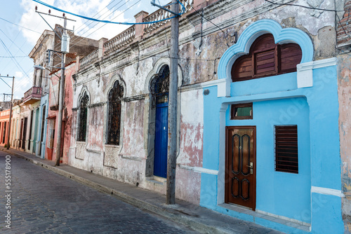 Facade of colorful colonial houses in the old center of Camagey (old town listed on UNESCO World Heritage List) - Central Cuba - North America