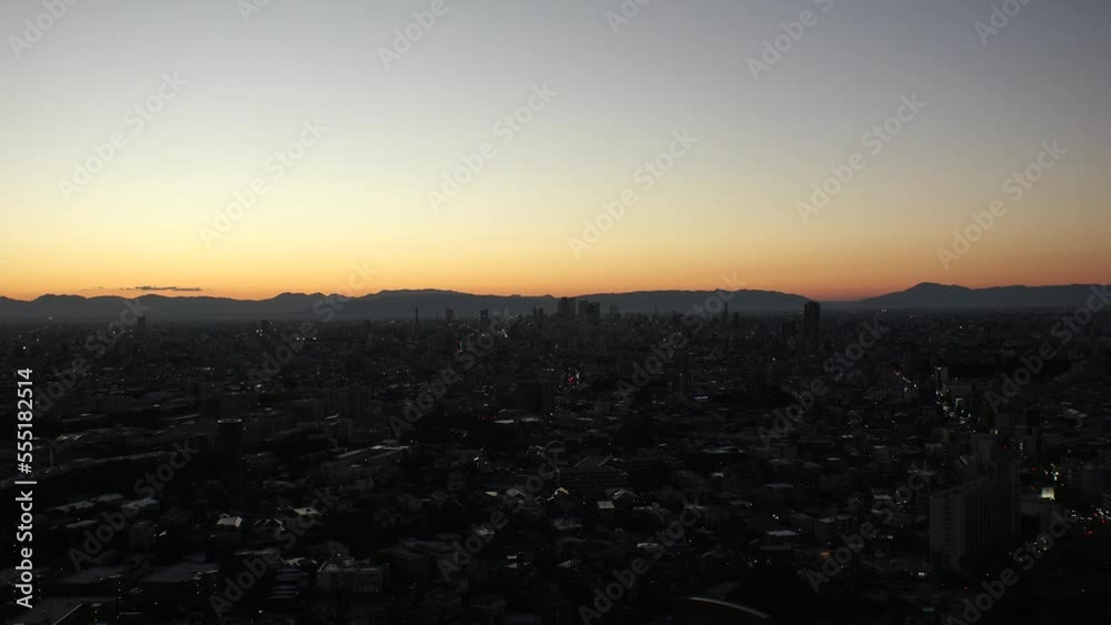 NAGOYA, JAPAN - OCTOBER 2022 : Aerial high angle view of NAGOYA CITY in sunset or sunrise. View of buildings and street traffic around Nagoya station and Sakae area (central downtown). NAGOYA, JAPAN - OCTOBER 2022 : Aerial high angle view of NAGOYA CITY in sunset or sunrise. View of buildings and street traffic around Nagoya station and Sakae area (central downtown).
