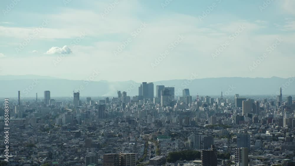 NAGOYA, JAPAN - OCTOBER 2022 : Time lapse shot of NAGOYA CITY in sunny daytime. Aerial high angle view of buildings and street traffic around Nagoya station and Sakae area (central downtown). NAGOYA, JAPAN - OCTOBER 2022 : Time lapse shot of NAGOYA CITY in sunny daytime. Aerial high angle view of buildings and street traffic around Nagoya station and Sakae area (central downtown).