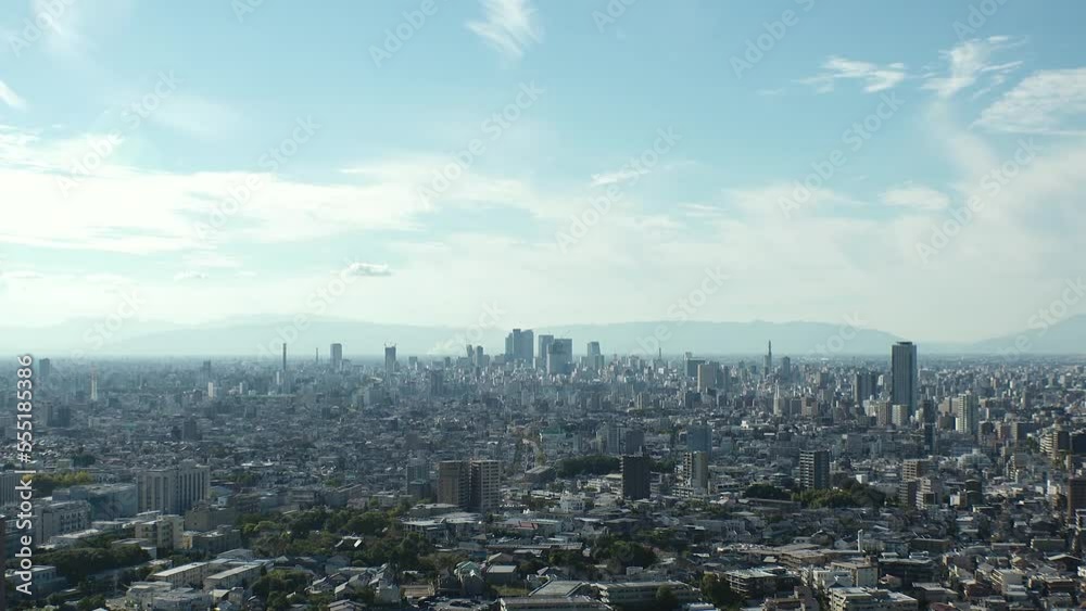 NAGOYA, JAPAN - OCTOBER 2022 : Aerial high angle view of NAGOYA CITY in sunny daytime. View of buildings and street traffic around Nagoya station and Sakae area (central downtown). Time lapse shot. NAGOYA, JAPAN - OCTOBER 2022 : Aerial high angle view of NAGOYA CITY in sunny daytime. View of buildings and street traffic around Nagoya station and Sakae area (central downtown). Time lapse shot.
