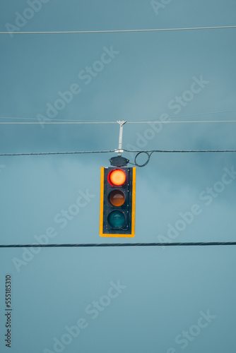 Urban scene with traffic light and cloudy sky
