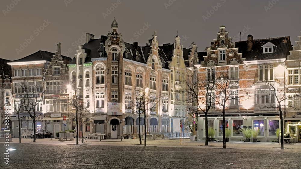 Friday market square with illuminated historic guild houses now housing bars and restaurants in the city of Ghent Flanders Belgium at night 
