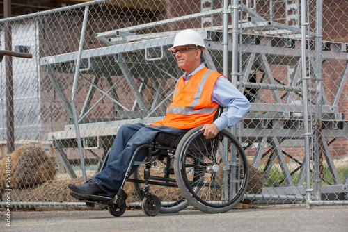 Project engineer with a Spinal Cord Injury in a wheelchair at job site photo