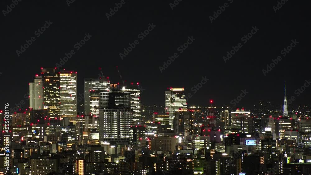 NAGOYA, JAPAN- OCT 2022 : NAGOYA CITY at night. Aerial high angle view of buildings and street traffic around Nagoya station and Sakae area (central downtown). Time lapse shot. Travel concept video. NAGOYA, JAPAN- OCT 2022 : NAGOYA CITY at night. Aerial high angle view of buildings and street traffic around Nagoya station and Sakae area (central downtown). Time lapse shot. Travel concept video.