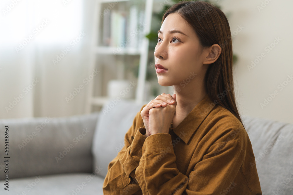Believe faith charity, calm asian young woman show gratitude, folded hands in prayer feel grateful, meditating with her eyes closed, praying to request God for help. Religious, forgiveness concept. Believe faith charity, calm asian young woman show gratitude, folded hands in prayer feel grateful, meditating with her eyes closed, praying to request God for help. Religious, forgiveness concept.