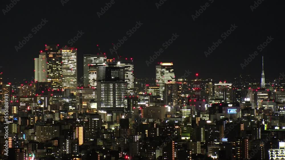 NAGOYA, JAPAN- OCT 2022 : Aerial high angle view of NAGOYA CITY at night. Buildings and street traffic around Nagoya station and Sakae area (central downtown). Time lapse shot. Travel concept video. NAGOYA, JAPAN- OCT 2022 : Aerial high angle view of NAGOYA CITY at night. Buildings and street traffic around Nagoya station and Sakae area (central downtown). Time lapse shot. Travel concept video.
