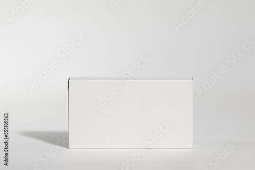 Mockup of a white box of parapharmacy product, standing, includes tracing