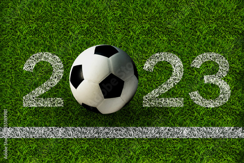 Top view of soccer ball on soccer field with number 2023. Tournament concept. photo