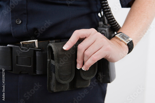 Close up of pouches on a cop's waist belt. photo