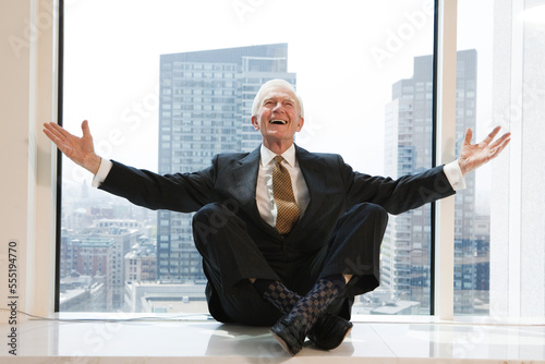 Businessman smiling in an office. photo