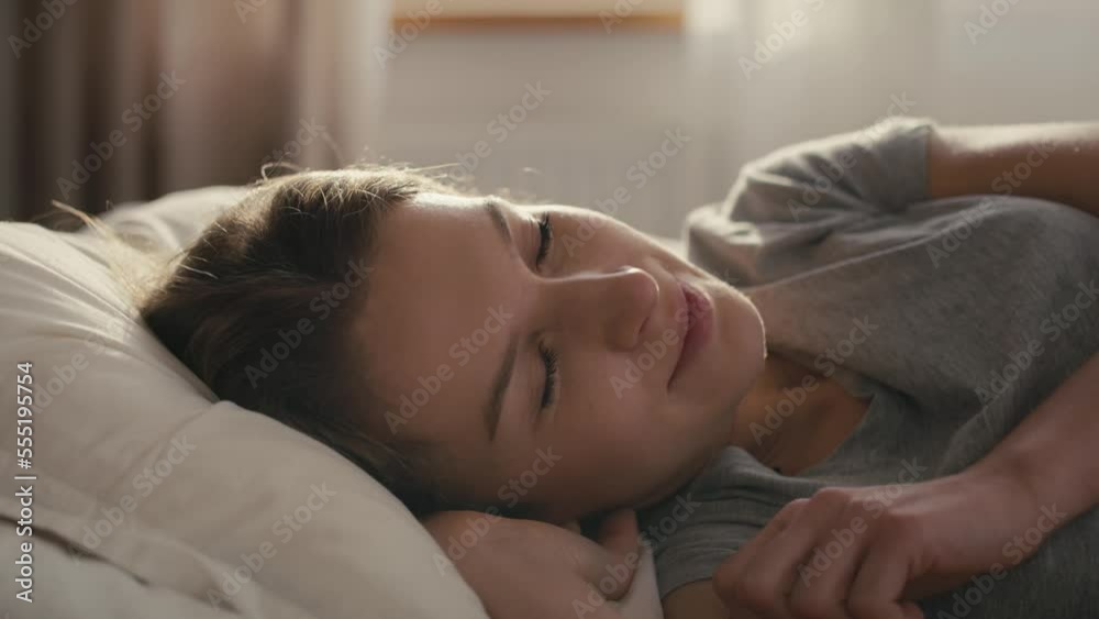 Caucasian woman waking up in sunny day Caucasian woman waking up in sunny day