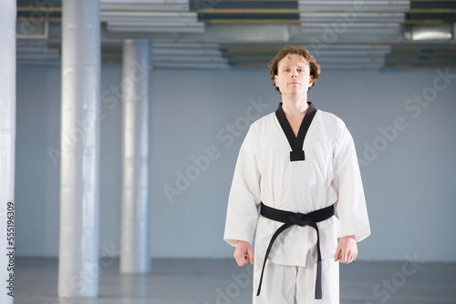 Young man in karate uniform photo
